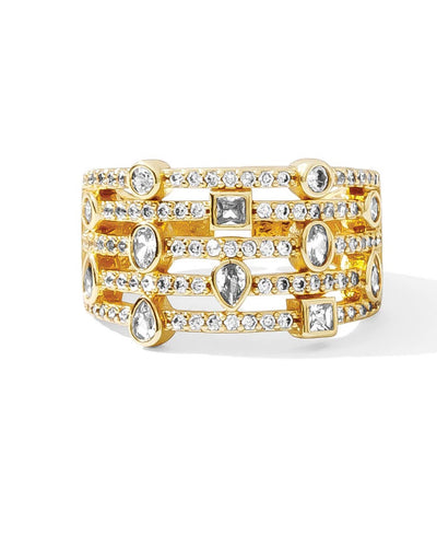 The "All that Shimmers Pave Statement Ring - Gold" features a wide band embellished with sparkling diamonds and cubic zirconia in geometric shapes, offering a luxurious and ornate look with an elegant, adjustable fit.