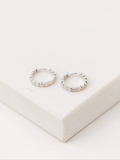 Cleo Hoop Earrings in silver with a textured rhodium-plated brass design, 15mm in diameter.