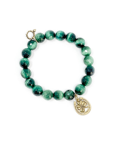 This alluring bracelet, the "Powerbeads by Jen Faceted Emerald Tiger Eye with Lucky 4-Leaf Clover Horseshoe," features round green beads in various shades and a gold flower charm in a circular frame, complemented by a decorative gold infinity symbol.