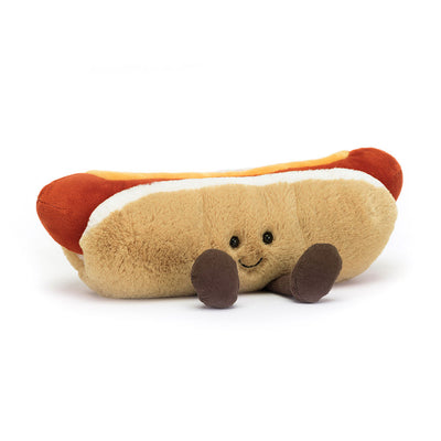 Front view of the Jellycat Amuseables Hot Dog plush toy with a friendly embroidered face, fluffy bun, and charming mustard detail.