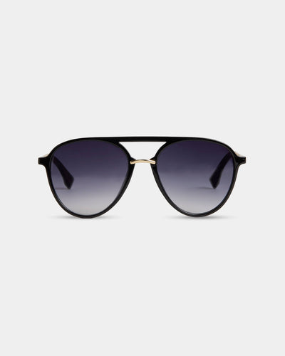 A pair of modern aviator sunglasses with a black frame, gold accents, and dark gradient lenses.