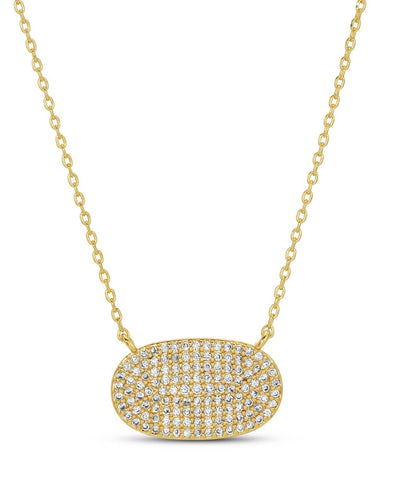 A gold-plated necklace featuring an oval pendant encrusted with pave cubic zirconia stones, suspended from a delicate gold chain.